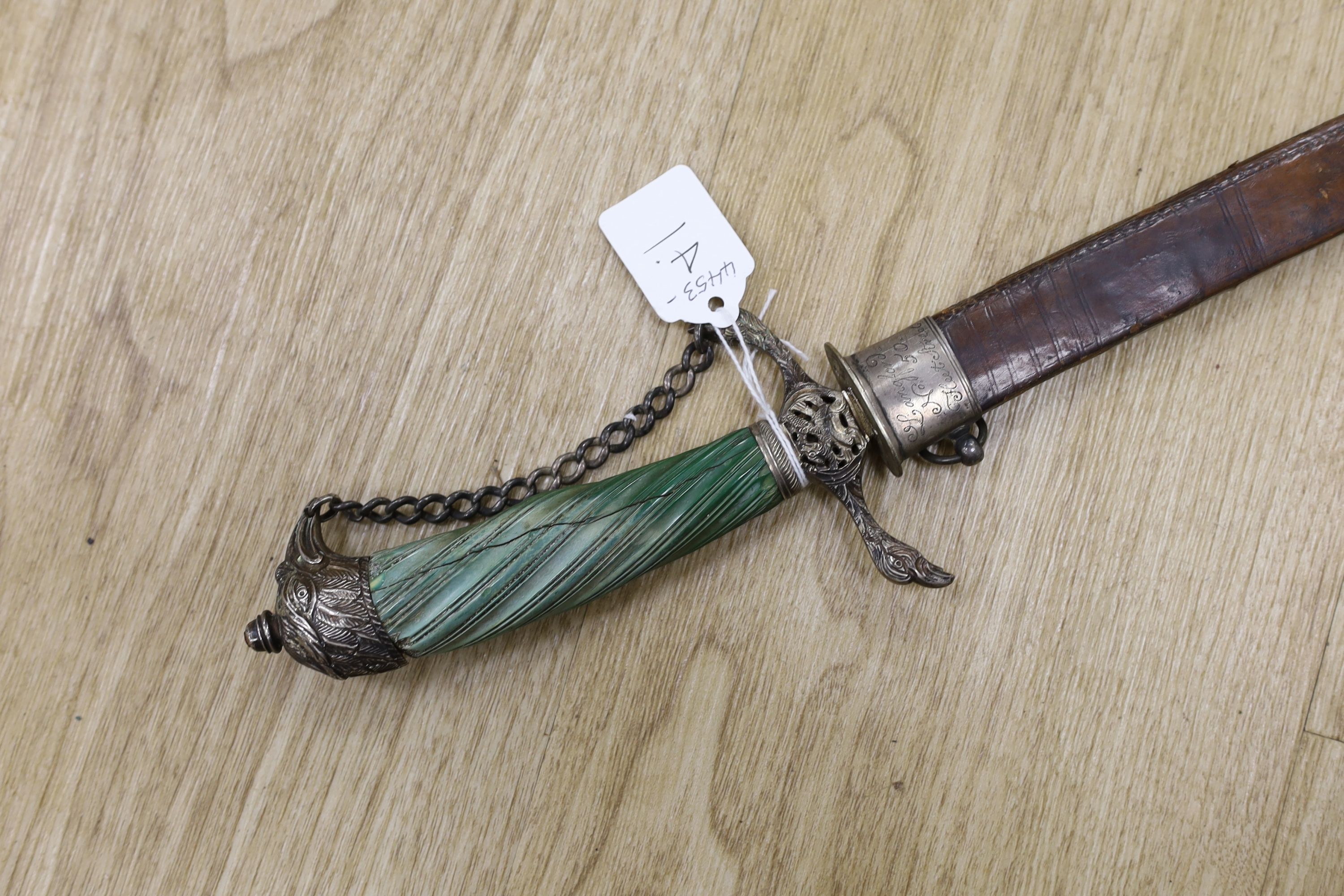 An English silver hilt hanger c.1770, London, maker M.B (year letter indistinct) eagle head pommel and crosspiece finials, spiral carved, green-stained ivory grip, curved fullered blade 63cms, retaining the top of its si